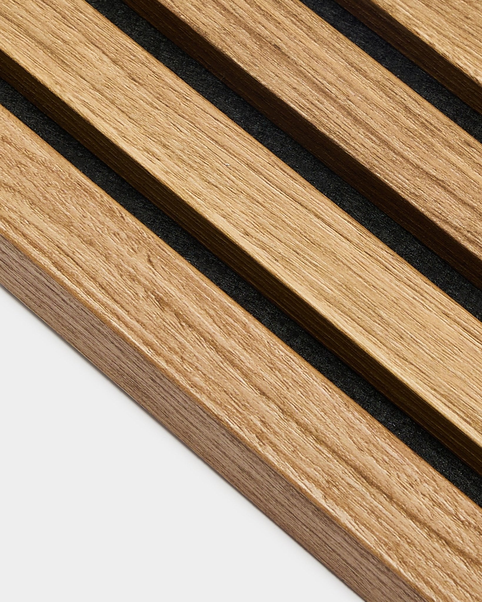 Close-up of WoodUpp Akupanel acoustic panel: parallel English Oak end lamella slats, 2.2 cm wide, mounted on an MDF frame for a minimalist Nordic look.